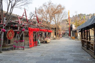 Beijing, China- 8 Nov 2024: Traditional Chinese house inside Gubei Water Town in China. Gubei Water Town is a planned town, built for the tourist market clipart