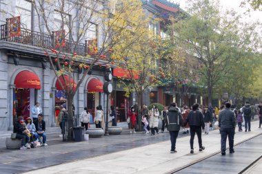 Beijing, China-11 Nov 2024: View of Qianmen pedestrian street in Beijing. Qianmen is a historic Beijing area, known for its iconic gate, traditional architecture, and shopping. clipart