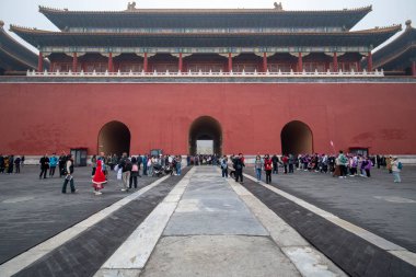 Beijing, China- 2 Nov 2024: Tourists walk through Wumen gate to enter Forbidden City, ancient Chinese royal palace, world-famous historical building in Beijing, China clipart