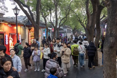 Beijing, China-9 Nov 2024: View of Nanluoguxiang in Beijing, China. It is the most popular and one of the oldest Hutongs in Beijing with a history of more than 740 years clipart