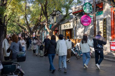 Beijing, China-10 Nov 2024: View of Nanluoguxiang in Beijing, China. It is the most popular and one of the oldest Hutongs in Beijing with a history of more than 740 years clipart