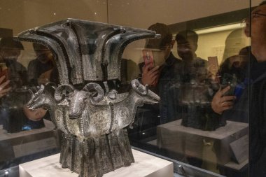 Beijing, China-12 Nov 2024: Four goat Square Zun displayed inside National Museum of China in Beijing. The four goats stand facing in four directions, looking serene and calm clipart