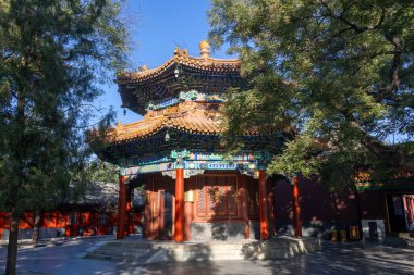 Beijing, China- 5 Nov 2024: West Stele Pavilion inside the Lama Temple in Beijing, China. Lama Temple is one of the largest and most important Tibetan Buddhist monasteries in the world clipart