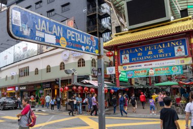 Kuala Lumpur, Malaysia- Dec 23 2024: Road sign of Petaling street (jalan Petaling) in Chinatown.. Ethnic Chinese began settling Chinatown Petaling Street area since 1850s. clipart