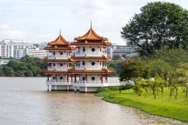 Singapore- 7 Feb, 2025: Twin pagoda towers in Singapore Chinese Garden. The rejuvenated Chinese Garden is where old meets the new, with familiar cultural landmarks clipart