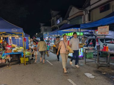 Johor Bahru, Malaysia- 2 Oct 2025:  People visit to a local night market in Johor Bahru, Malaysia. Also called as pasar malam, it is a popular place for local people to shop