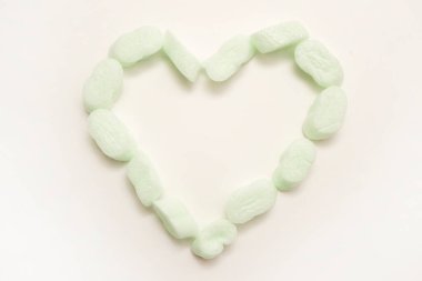 Heart shape packaging filling foam. Void fill packaging solutions. Valentine's day theme, background, greeting card. Emotional look of natural things. recyclable product. Go green.