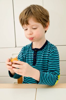 Celebrating Easter with a chocolate egg. Happy family vacation. Celebrating Easter. Happy family vacation.