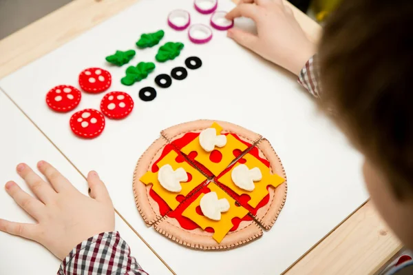 Felt pizza. Felt food toys for the kids. Preschool game for young children. Montessori education