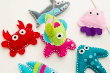 Hand made stuffed felt toy. Fishing rod with magnet and fishes or other sea animals. Different colors. Safe eco stuffed toy for infants and toddlers. Early education implement.