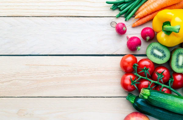 stock image Healthy food. Fruits and vegetables. On a black wooden background. View from above. Copy space.