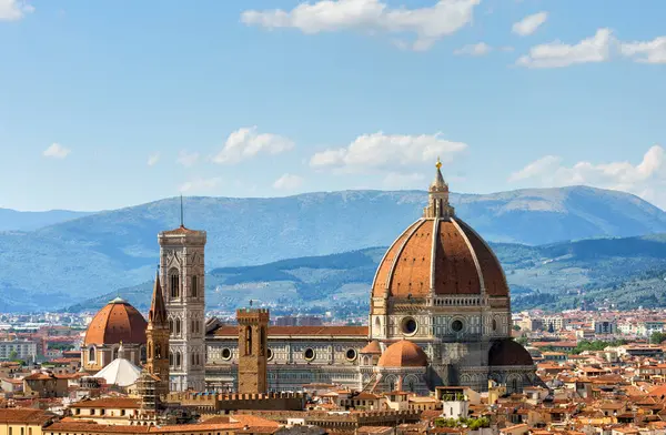 stock image View of the Duomo Santa Maria del Fiore cathedral and Bell Tower of Giotto in Florence, Italy in a colorful sunset, aerial view