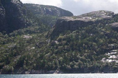 Stavanger Norway Fjord Coastline seen from offshore boat on cloudy summer day 