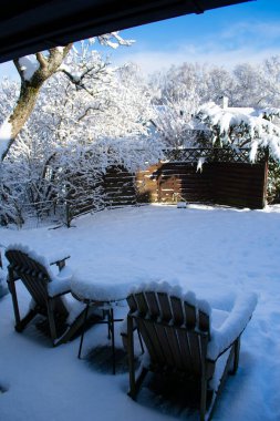 snow covered backyard patio furniture norway clipart