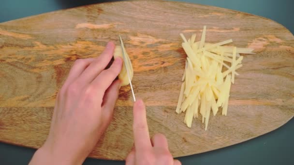 Woman Cuts Potato Knife Very Small Pieces Top View Kitchen — Stock Video