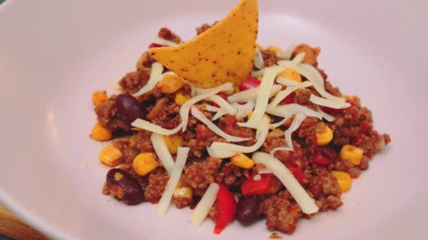 Delicious Meat Chili Con Carne Grated Cheese Tortilla Tracking Shot — Stock Video