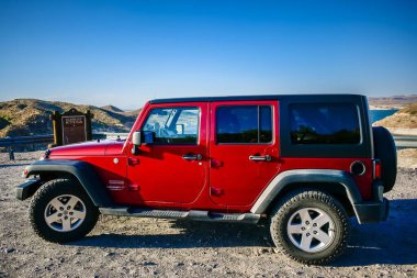 Elephant Butte, NM, USA - May 1, 2022: Jeep Wrangler Unlimited Sports parked along the preserve park