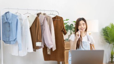 Professional female designer sketches of clothes through laptop in the design studio, Fashion designer, Creativity and ideas, Mannequin, Shirt sketch, Color scheme, Garment accessories ,Freelance.