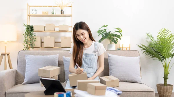 Online selling business, Small business owners are checking inventory in order to prepare them for proper delivery to customers, Online shopping SME entrepreneur, Delivery of goods to consumers.