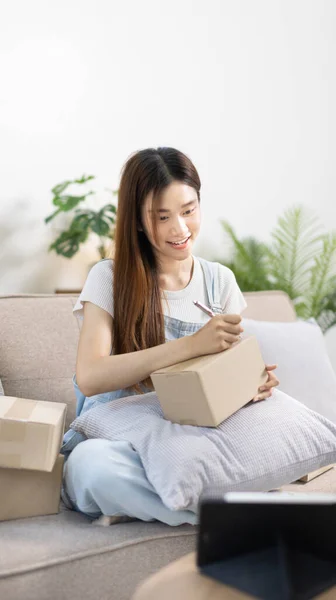 Online selling business, Small business owners are checking inventory in order to prepare them for proper delivery to customers, Online shopping SME entrepreneur, Delivery of goods to consumers.