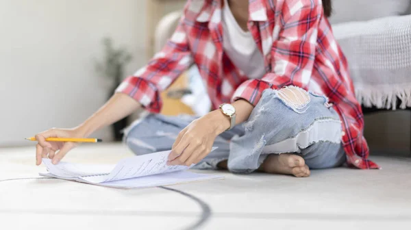 stock image Asian woman specializes in music is composing the lyrics and melody for the opening of a new single, Using imagination and concentration in creating music, acoustic guitar, Creation of music notes.