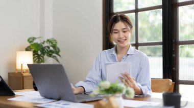 Work from home, College student is analyzing data or doing homework assignments in her house, Use your laptop to search for information and educate yourself at home, Stay home, Internet learning.