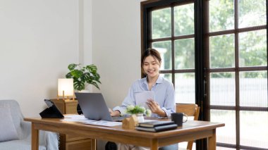 Work from home, College student is analyzing data or doing homework assignments in her house, Use your laptop to search for information and educate yourself at home, Stay home, Internet learning.