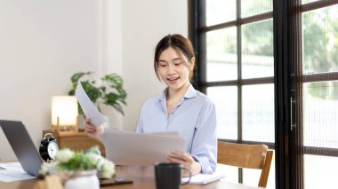 Work from home, College student is analyzing data or doing homework assignments in her house, Use your laptop to search for information and educate yourself at home, Stay home, Internet learning.