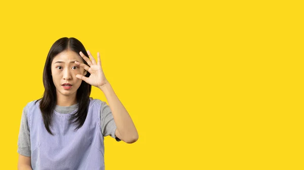 Woman stunned with big eyes isolated on yellow background, Feels fear or amazement surprised received unbelievable, Terrified news , Surprise emotion enthusiastic surprised shocked.