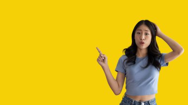 Asian woman pointing finger inviting click here, It is recommended to follow this direction or click on this link, Space for promotion here, Register or apply for membership, Click here.