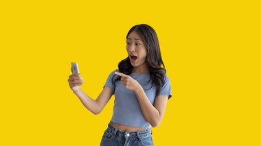 Call sign, Bright young asian woman inviting to call isolated on yellow background, Suggest to call or invite to apply for membership, Isolated on yellow background