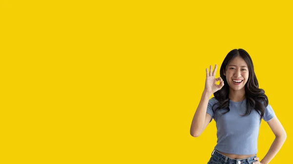 Young Asian Woman Yellow Background Doing Sign Hands Symbol Welcome — Foto de Stock