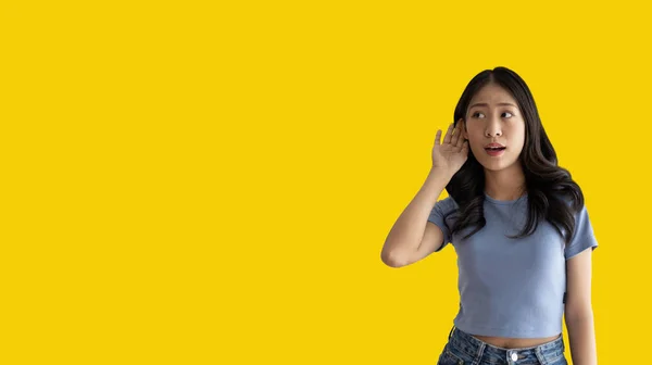 Asian Woman Eavesdropping Overhearing Secret Conversation Isolated Yellow Background Gossip — Photo