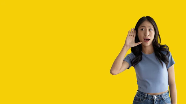 Asian Woman Eavesdropping Overhearing Secret Conversation Isolated Yellow Background Gossip — Foto de Stock