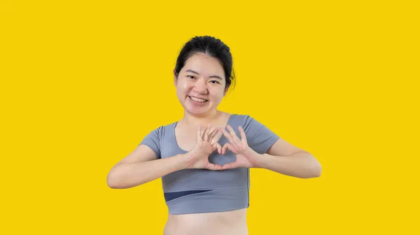 Asian Young Woman Bright Smile Making Heart Symbol Shape Hands — стоковое фото