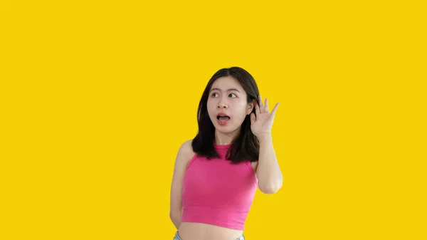 Asian Woman Eavesdropping Overhearing Secret Conversation Isolated Yellow Background Gossip — Stok fotoğraf