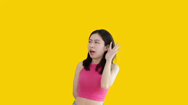 Asian Woman Eavesdropping Overhearing Secret Conversation Isolated Yellow Background Gossip — Stockfoto
