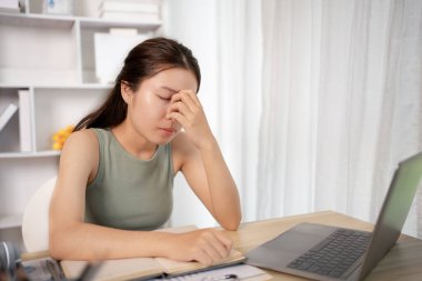 Young woman stressed or worried about doing a wrong job, Despair or disappointment, Sad feeling, Suffering, Desperate, Hopeless, Fail, disastrous, bankrupt, Scared, panicky, Failure of life.