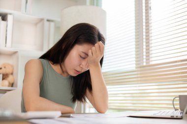 Young woman stressed or worried about doing a wrong job, Despair or disappointment, Sad feeling, Suffering, Desperate, Hopeless, Fail, disastrous, bankrupt, Scared, panicky, Failure of life.