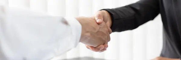 Close-up of Head of Human Resources and new employees Shake hands to congratulate them on their collaboration, Successful job interviews and the willingness to work together concept.