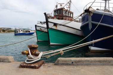 Fishing Trawlers Moored To Bollard On Harbor Quay, Gansbaai, South Africa