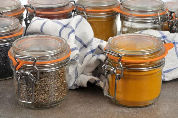 Jars Curry Dried Basil Close Tea Towel Background — Stock Photo, Image