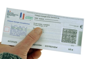 French energy check in hand close up on white background