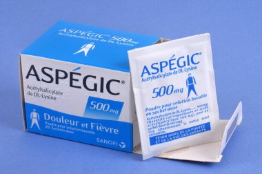 Box of Aspegic 500 and sachet of Aspegic 500 close-up on blue background