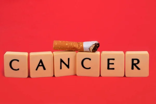 Cancer Concept Alphabet Letters Cigarette Butt Red Background — Zdjęcie stockowe