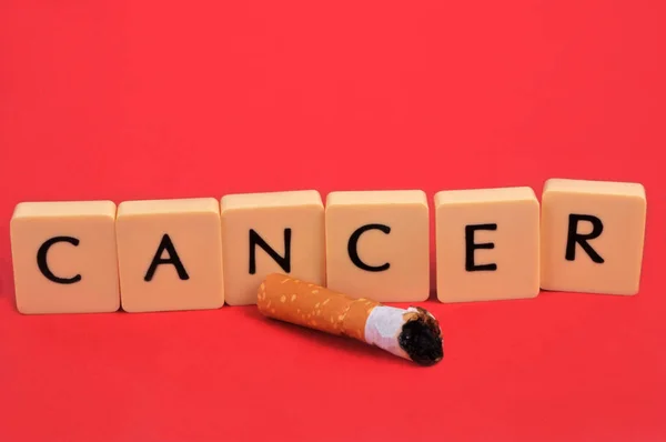 Cancer Concept Alphabet Letters Cigarette Butt Red Background — Zdjęcie stockowe
