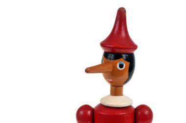 Close-up portrait of wooden Pinocchio puppet on white background clipart
