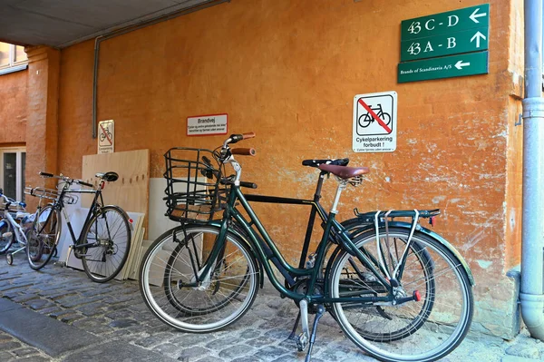 stock image Bicycles parked under a no parking sign written in Danish