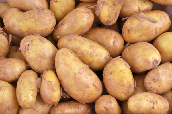 Surowe Ziemniaki Zbliżyć Tle — Zdjęcie stockowe