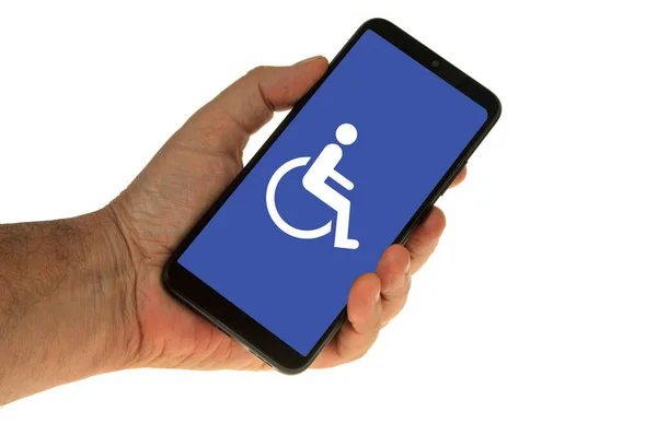 Smartphone Hand Witte Achtergrond Met Handicap Symbool Weergegeven Het Scherm Stockfoto